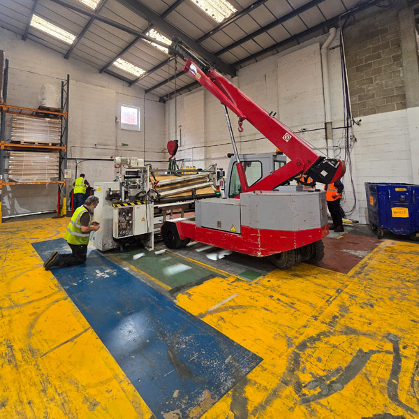 heavy lifting a machine with a small crane